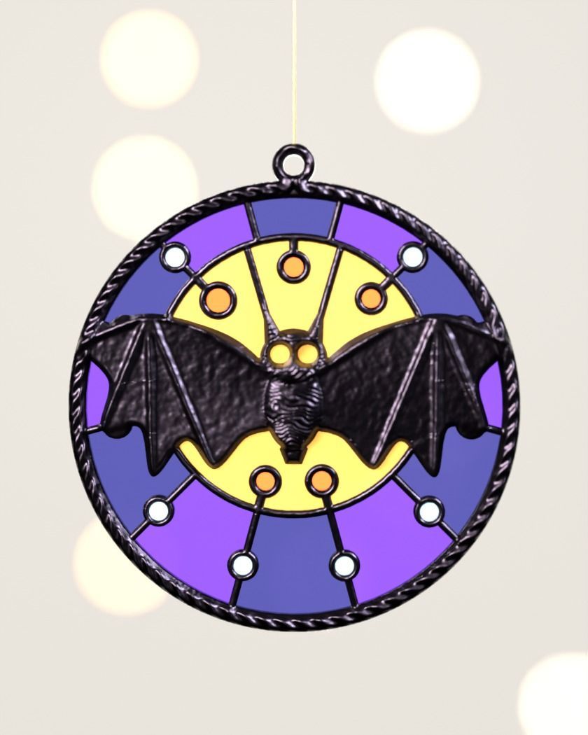 Digital preview by day: a black bat over a yellow moon in a round frame with violet and blue windows
